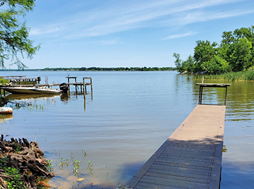 Lake Fork on a beautiful, spring day with an empty, fishing pier